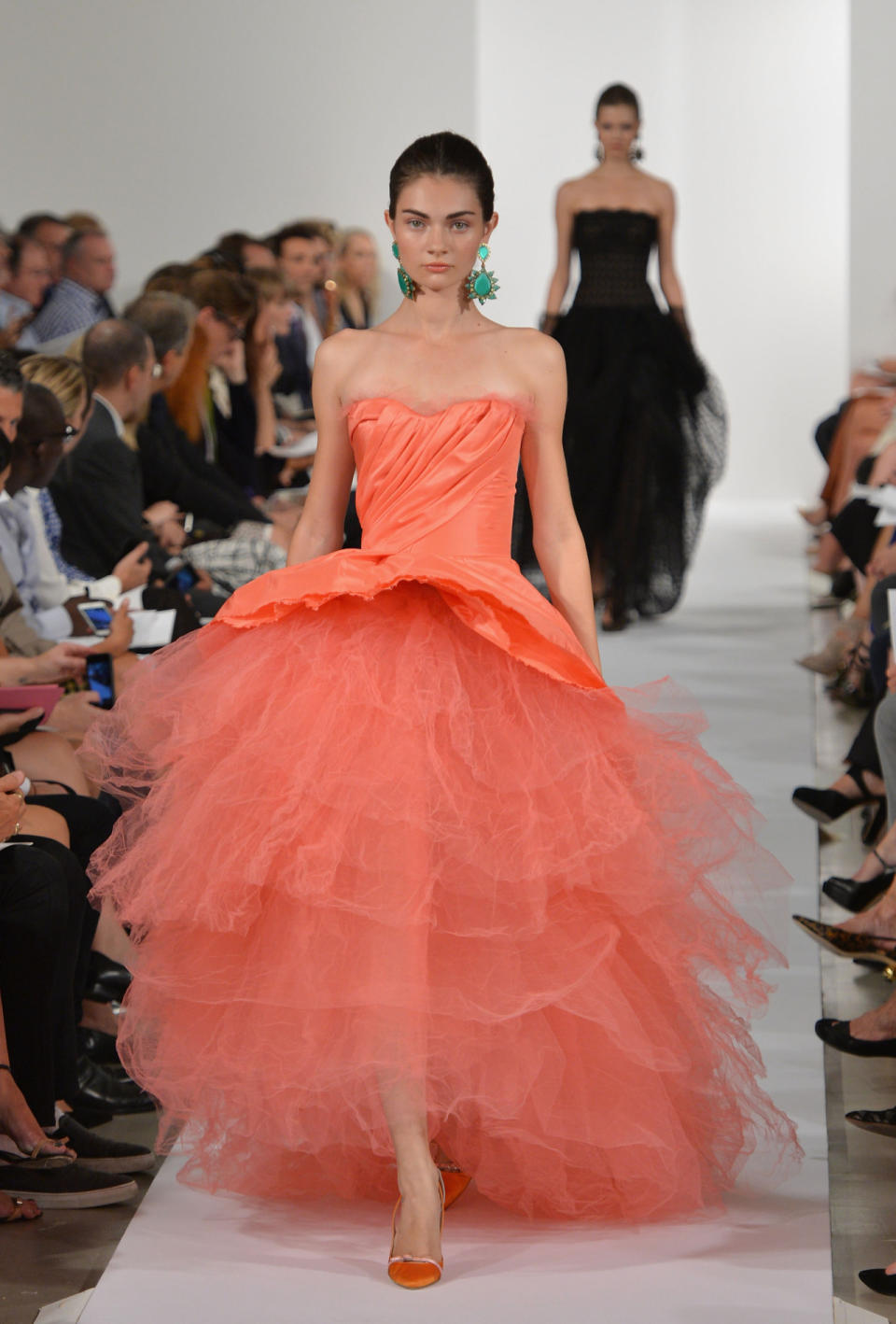 The designer has shown many ballerina-inspired looks over the year, but this full tulle skirt is a very creative adaptation. Dewy peachy makeup and a slick French braid keep it youthful.