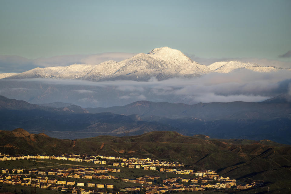 Snow-covered mountains are pictured above Santa Clarita, Calif., on Wednesday, Feb. 7, 2024. (David Crane/The Orange County Register via AP)