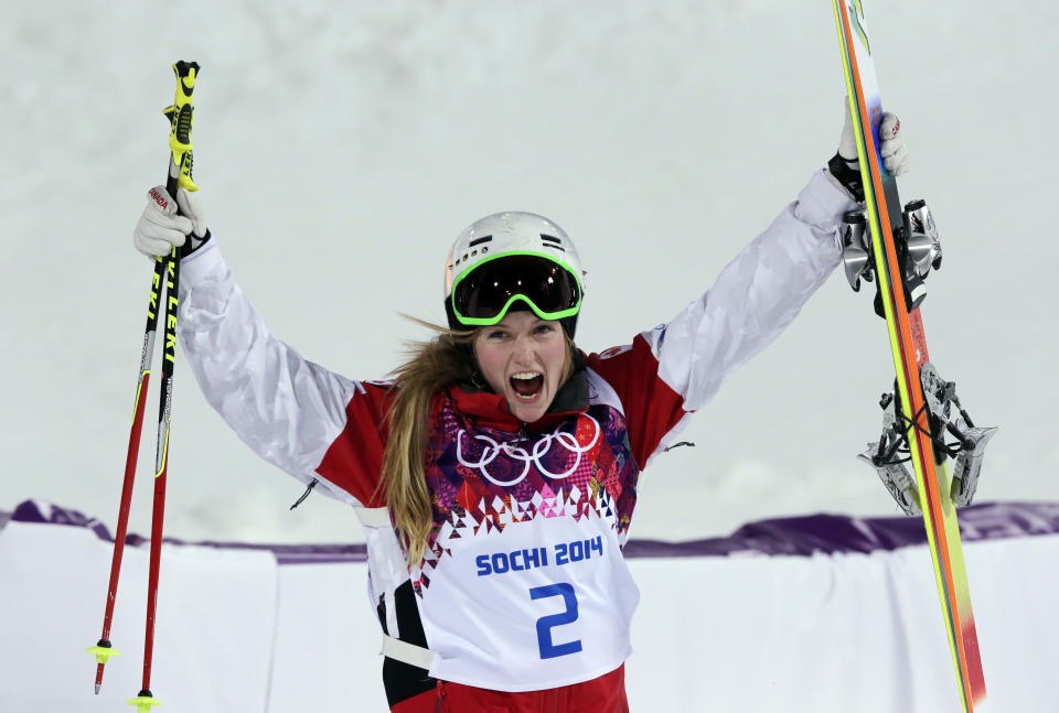 Canada's Justine Dufour-Lapointe celebrates after taking the gold medal in the women's moguls final at the Rosa Khutor Extreme Park, at the 2014 Winter Olympics, Saturday, Feb. 8, 2014, in Krasnaya Polyana, Russia. (AP Photo/Andy Wong)