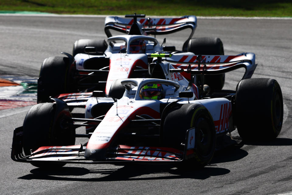 MONZA, ITALY - SEPTEMBER 11: Mick Schumacher of Germany driving the (47) Haas F1 VF-22 Ferrari leads Kevin Magnussen of Denmark driving the (20) Haas F1 VF-22 Ferrari during the F1 Grand Prix of Italy at Autodromo Nazionale Monza on September 11, 2022 in Monza, Italy. (Photo by Mark Thompson/Getty Images)