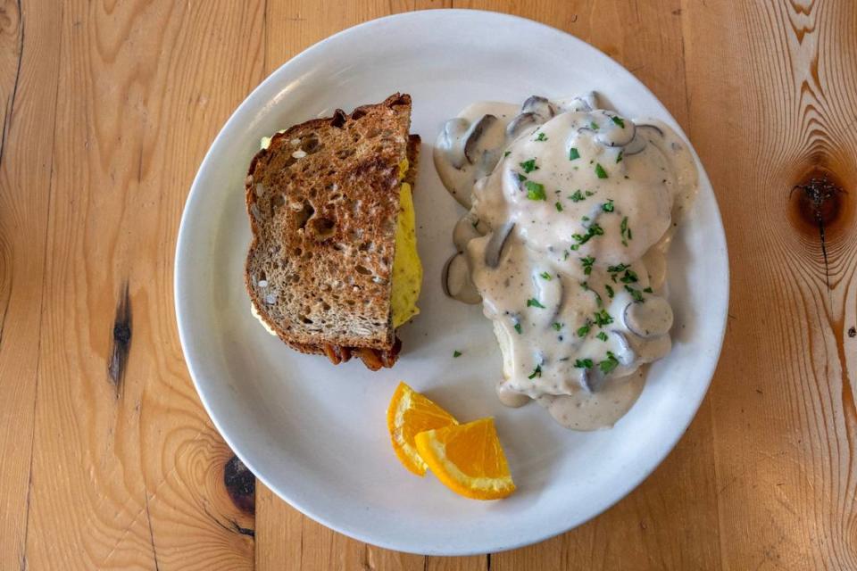 A great Happy Gillis combo breakfast: The half-sandwich includes thick-cut bacon, scrambled eggs, cheddar cheese and aioli on Farm to Market Grains Galore toast. Pair it with a half-order of mushroom biscuits and gravy.