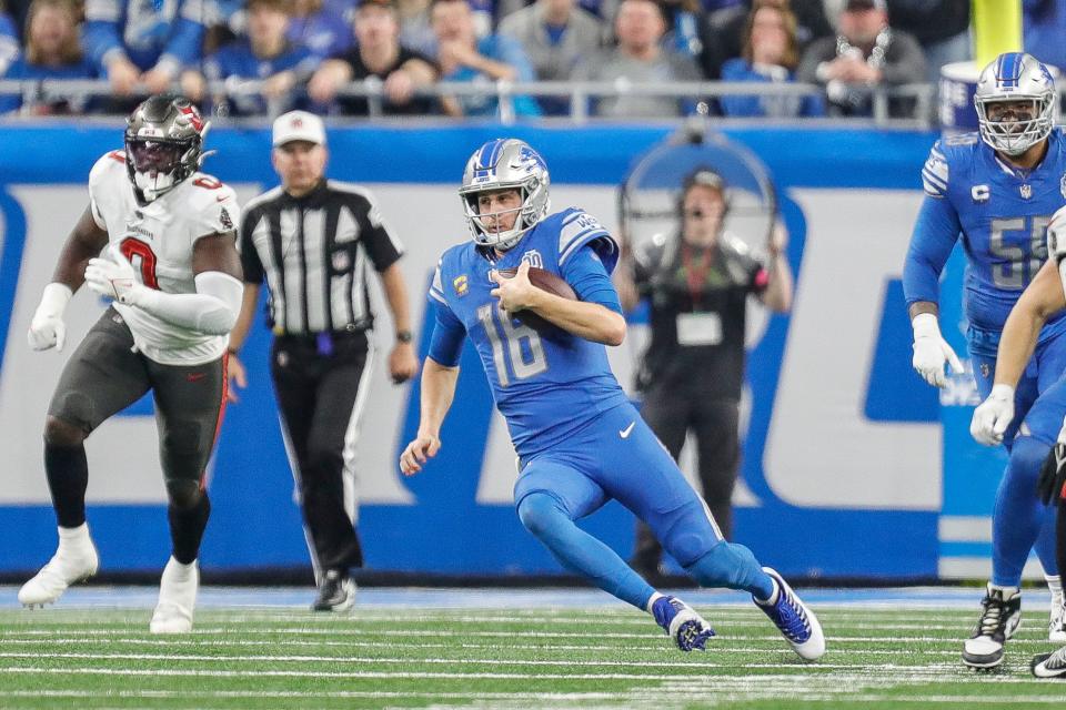 Detroit Lions quarterback Jared Goff (16) keeps the ball for a run against Tampa Bay Buccaneers during the first half of the NFC divisional round at Ford Field in Detroit on Sunday, Jan. 21. 2024.