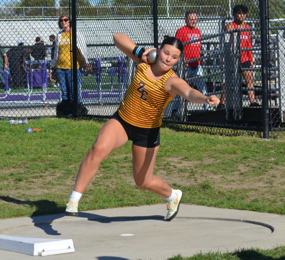 Zeeland East's Anna Tilden competes in the discus at the OK Green Conference meet.