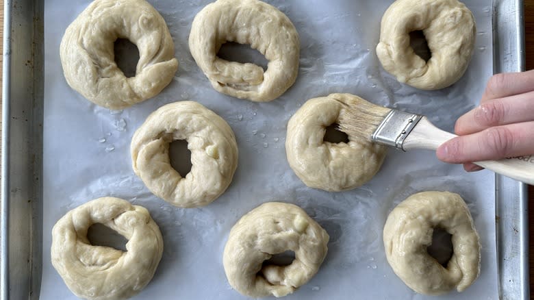 Brushing bagel rings with egg white