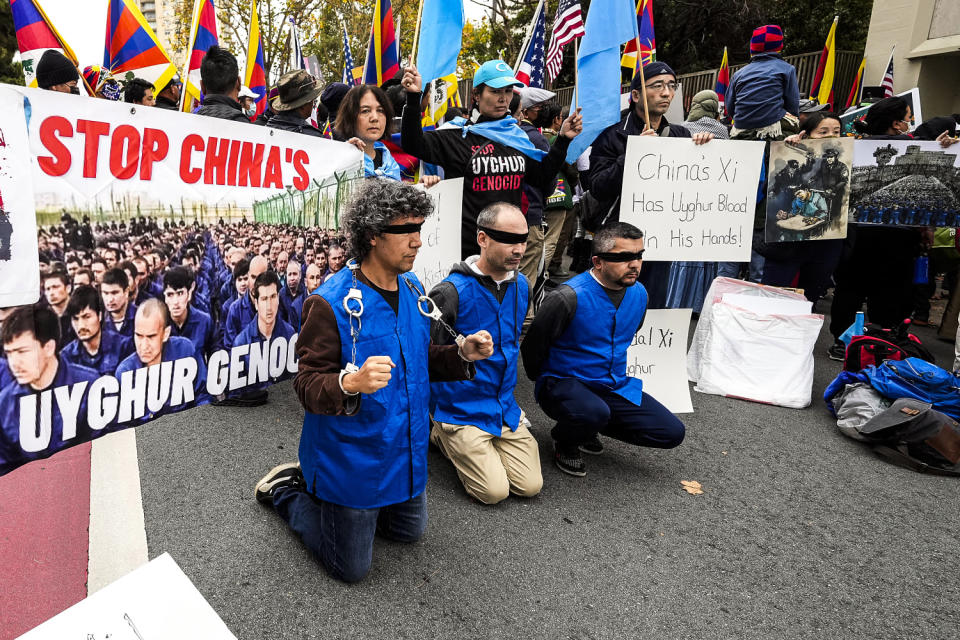 Image: Demonstrators gather outside of the Chinese Consulate (Tony Avelar / AP)