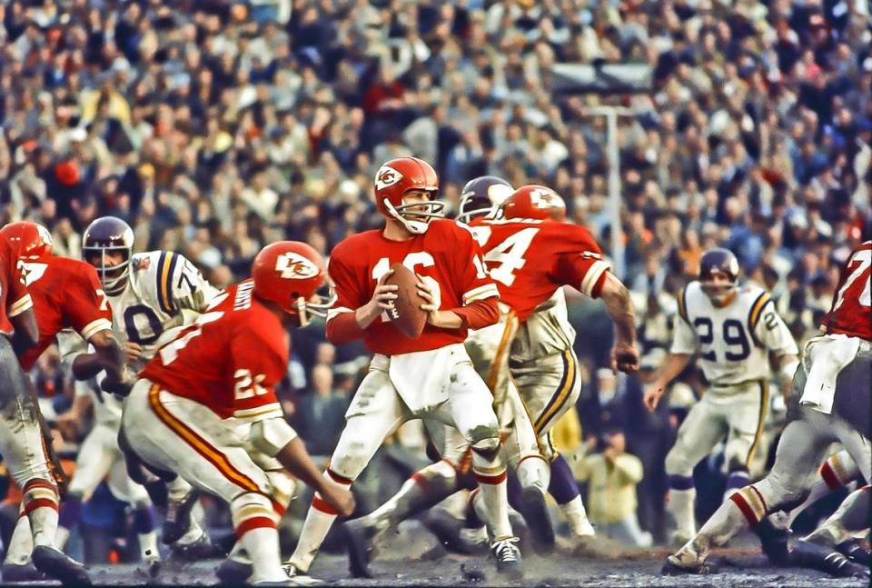 Kansas City Chiefs quarterback Len Dawson gets pass protection before throwing the final touchdown pass of the game to wide receiver Otis Taylor as the Chiefs defeated the Minnesota Vikings to win Super Bowl IV.