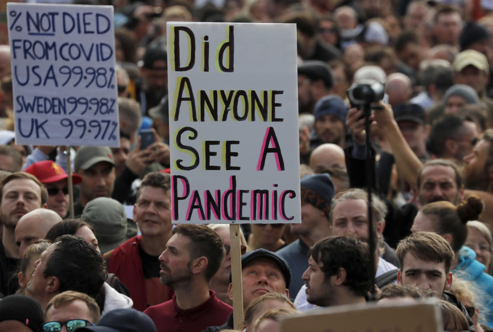 People take part in a 'We Do Not Consent' rally at Trafalgar Square, organised by Stop New Normal, to protest against coronavirus restrictions, in London, Saturday, Sept. 26, 2020. (AP Photo/Frank Augstein)