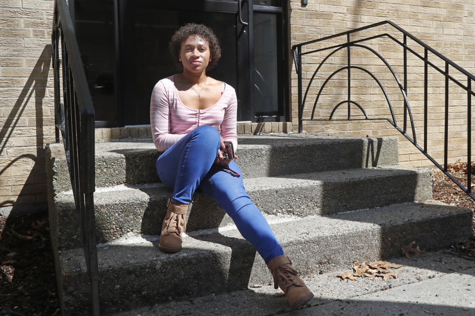 Jade Brooks at her apartment, Tuesday, March 31, 2020, in Boston. It's the first of the month and everybody knows the rent's due. Wednesday is the first time the landlord is knocking on the door since the coronavirus turned the economy upside down. (AP Photo/Elise Amendola)