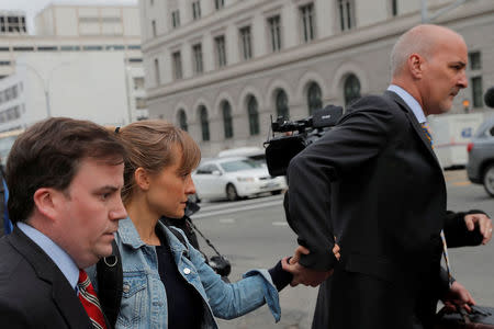 Actress Allison Mack, known for her role in the TV series "Smallville", departs after being granted bail following being charged with sex trafficking and conspiracy in New York, U.S., April 24, 2018. REUTERS/Lucas Jackson