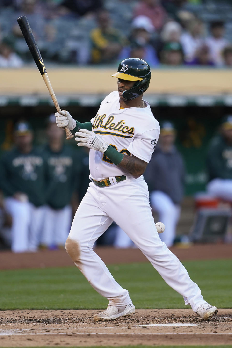 Oakland Athletics' Christian Bethancourt is hit by a pitch from Toronto Blue Jays' Yusei Kikuchi during the third inning of a baseball game in Oakland, Calif., Tuesday, July 5, 2022. (AP Photo/Jeff Chiu)