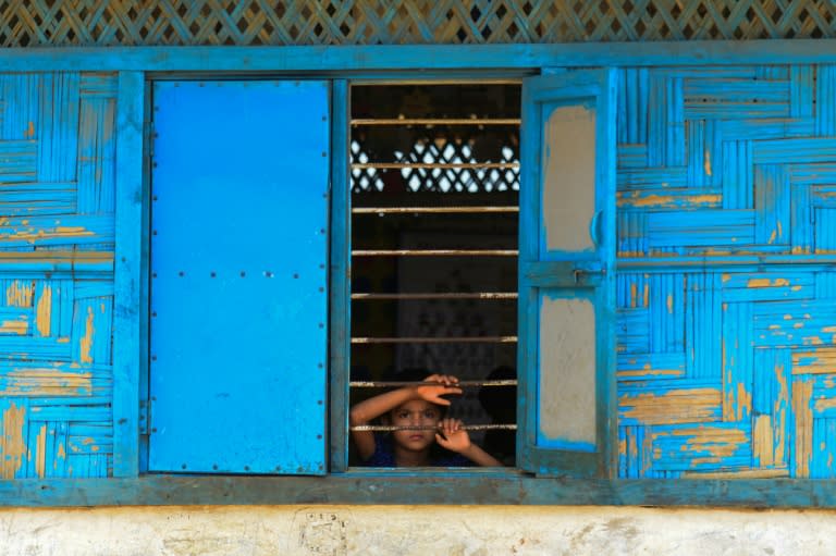 A Rohingya refugee looks out from a school window at Kutupalong refugee camp in Bangladesh's Ukhia district on April 5, 2018