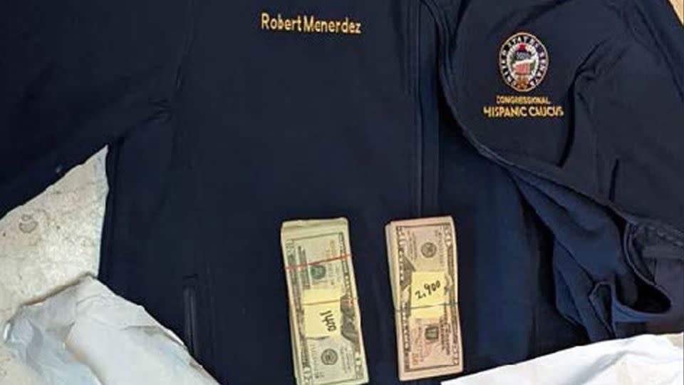 Prosecutors included this photo of a jacket bearing Menendez's name underneath stacks of $20 and $50 bills. - US District Court Southern District of New York