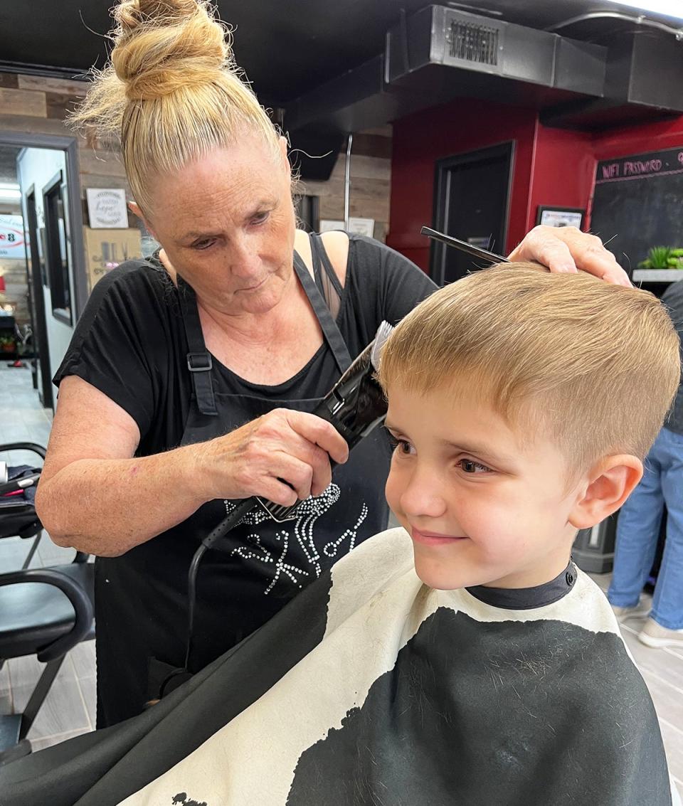 Trey Engle gets a haircut at '9one8 Salon and Spa.'