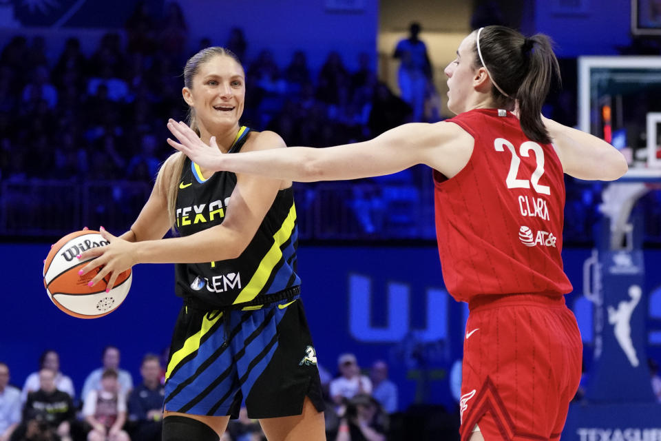 ARLINGTON, TEXAS - SEPTEMBER 01: Jacy Sheldon #4 of the Dallas Wings is defended by Caitlin Clark #22 of the Indiana Fever during the first half at College Park Center on September 1, 2024 in Arlington, Texas. NOTE TO USER: User expressly acknowledges and agrees that by downloading and/or using this photograph, user agrees to the terms of the Getty Images License Agreement. (Photo by Sam Hodde/Getty Images)