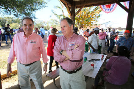 Democratic Alabama U.S. Senate candidate Doug Jones (C), greets supporters while campaigning at an outdoor festival in Grove Hill, Alabama, U.S. on November 4, 2017. REUTERS/Mike Kittrell