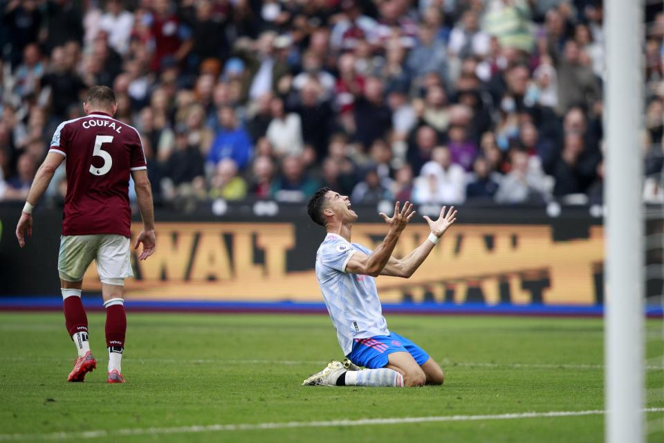 Manchester United's Cristiano Ronaldo reacts after he failed to score a goal during the English Premier League soccer match between West Ham United and Manchester United at the London Stadium in London, England, Sunday, Sept. 19, 2021. (AP Photo/Ian Walton)