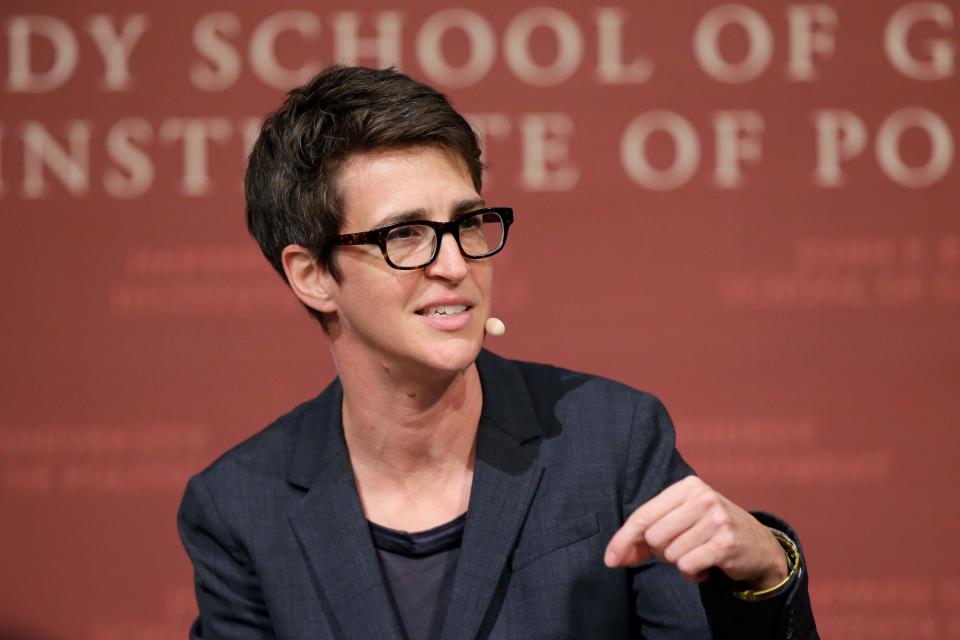 MSNBC political commentator Rachel Maddow is pictured moderating a forum panel at the John F. Kennedy School of Government at  Harvard University.