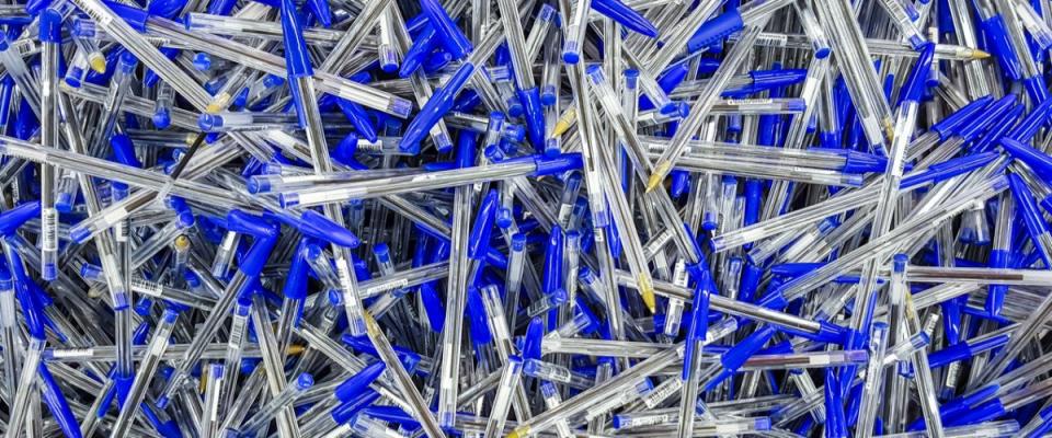 Many blue pens in a large pile