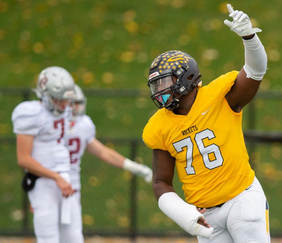 Streetsboro High School's Michael Hall Jr. reacts to teammate Donovan Washington's touchdown in a 54-21 win over Dover in 2020.