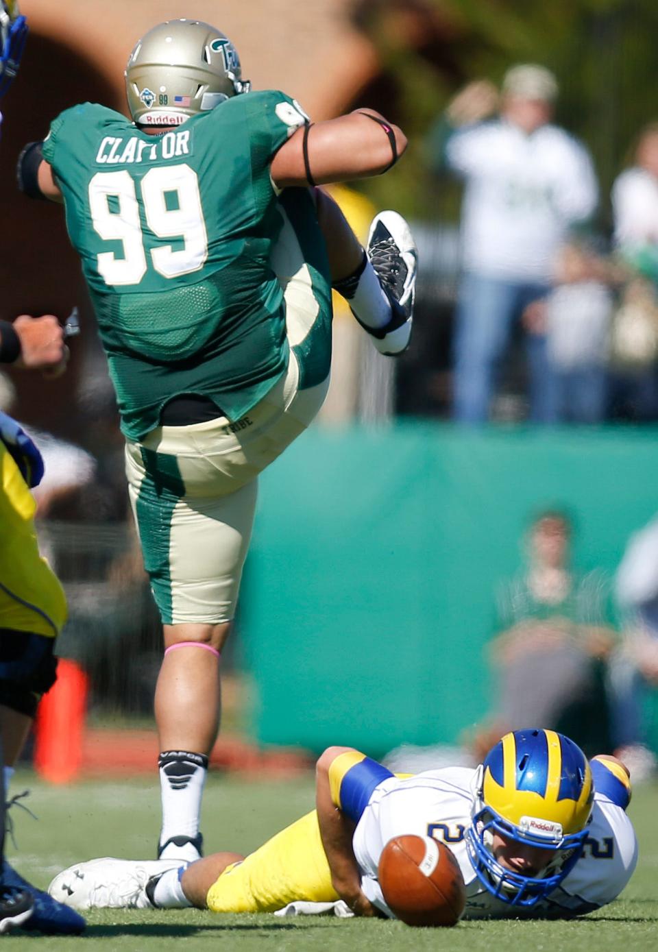 William and Mary defensive tackle Tyler Claytor celebrates a second quarter sack on Delaware quarterback Trent Hurley in the Tribe's 31-17 win at Zable Stadium in Williamsburg, Va., Saturday, Oct. 25, 2014.