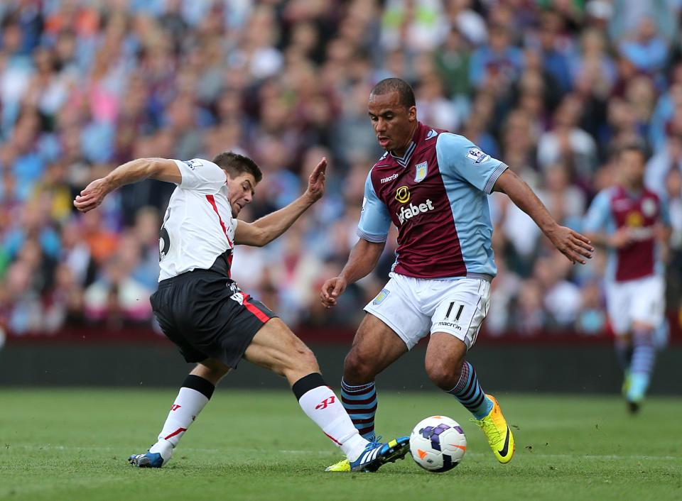 Liverpool's Steven Gerrard (left) and Aston Villa's Gabriel Agbonlahor (right) battle for the ball