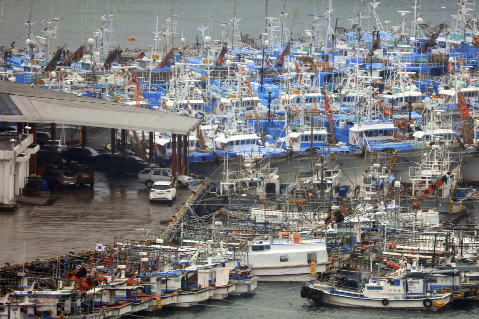 In this Sunday, Sept. 22, 2019, photo, fishing boats are anchored at a port as Typhoon Tapah approaches Jeju Island, South Korea. The powerful typhoon has battered southern South Korea after lashing parts of Japan’s southern islands with heavy rains and winds. (Park Ji-ho/Yonhap via AP)