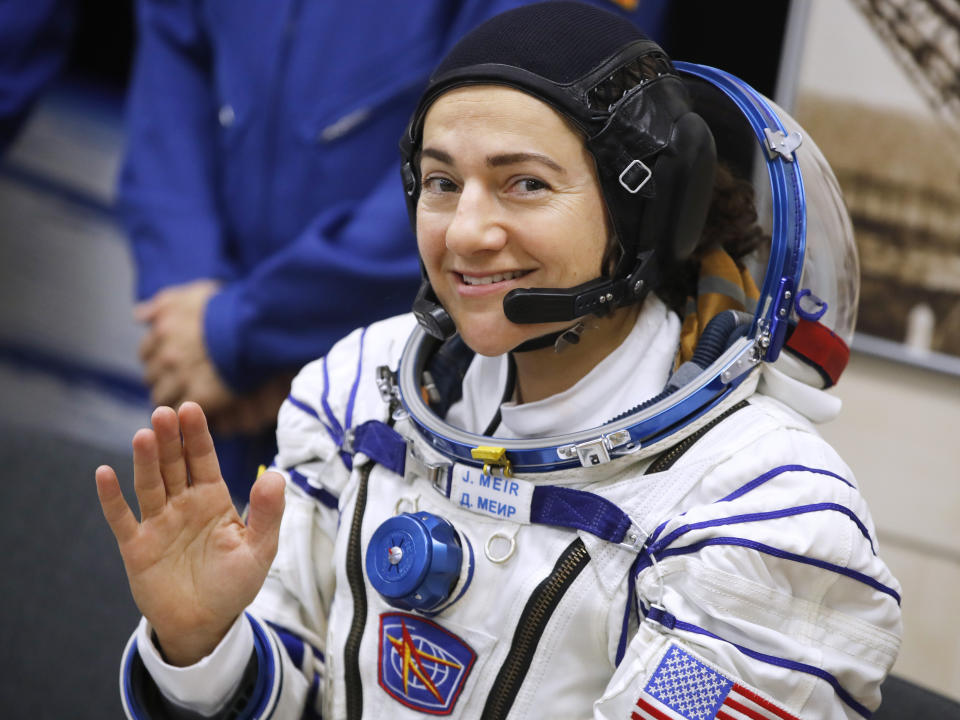 U.S. astronaut Jessica Meir, member of the main crew of the expedition to the International Space Station (ISS), waves prior the launch of Soyuz MS-15 space ship at the Russian leased Baikonur cosmodrome, Kazakhstan, Wednesday, Sept. 25, 2019. (AP Photo/Dmitri Lovetsky)