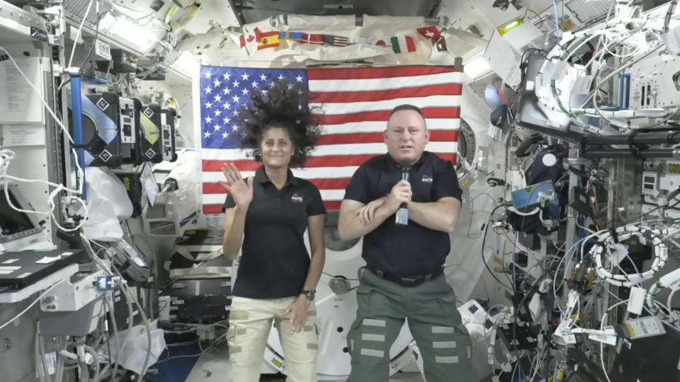 In this image from video provided by NASA, astronauts Suni Williams, left, and Butch Wilmore give a news conference aboard the International Space Station on Wednesday, July 10, 2024. (NASA via AP)