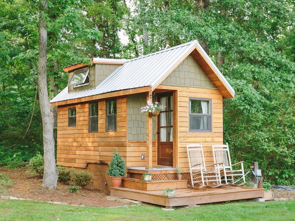 <p>The 204-square-foot "Wind River Bungalow" is the Chattanooga, Tennessee, home of tiny house enthusiasts Travis and Brittany Pyke, who started <a href="https://www.windrivertinyhomes.com/" rel="nofollow noopener" target="_blank" data-ylk="slk:Wind River Custom Homes;elm:context_link;itc:0;sec:content-canvas" class="link ">Wind River Custom Homes</a> to help others fulfill their dreams of living simply in mini dream homes. Constructed of rain-screen cedar and hardy siding for extreme durability, the bungalow is full of custom features, including a pine and cedar interior, polymer concrete counters, and a loft ladder integrated into the shelving system.</p><p><a class="link " href="https://www.windrivertinyhomes.com/wind-river-bungalow" rel="nofollow noopener" target="_blank" data-ylk="slk:SEE INSIDE;elm:context_link;itc:0;sec:content-canvas">SEE INSIDE</a></p>