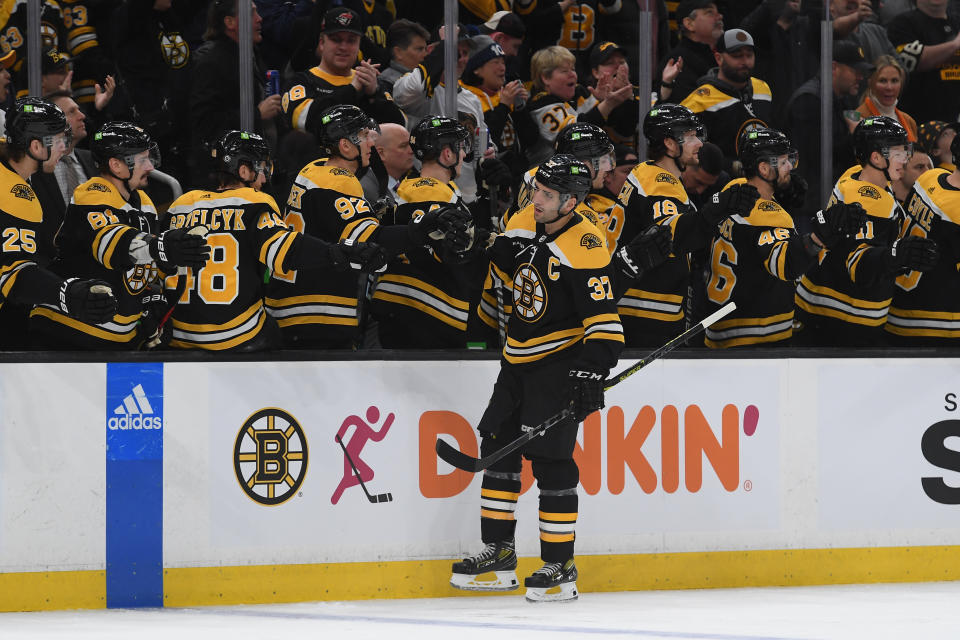 BOSTON, MASSACHUSETTS - MARCH 25: Patrice Bergeron #37 of the Boston Bruins celebrates his first period goal against the Tampa Bay Lightning at the TD Garden on March 25, 2023 in Boston, Massachusetts. (Photo by Steve Babineau/NHLI via Getty Images)