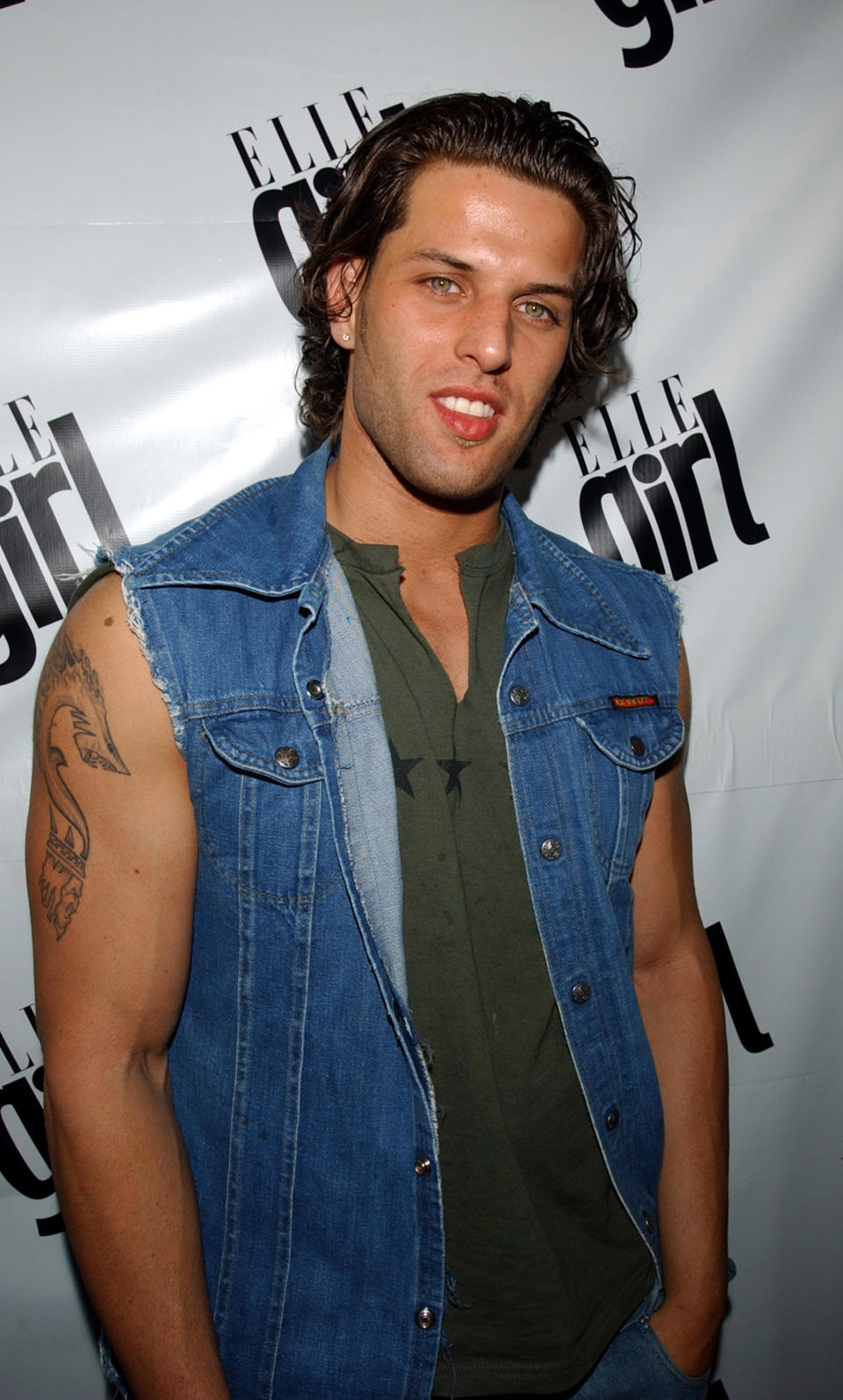 Close-up of Devin in a denim vest