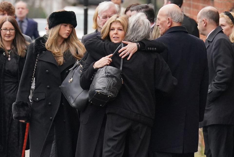 Kate Garraway received a hug from a friend before the service (PA)