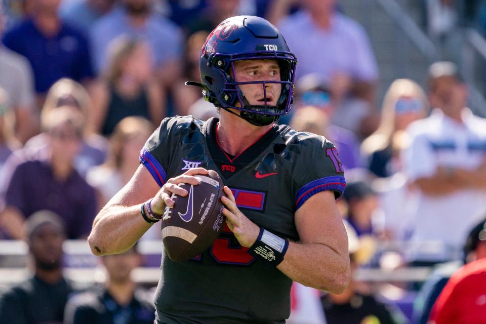 TCU quarterback Max Duggan (15) looks to pass during the first half of an NCAA college football game against Oklahoma State in Fort Worth, Texas, Saturday, Oct. 15, 2022. (AP Photo/Sam Hodde)