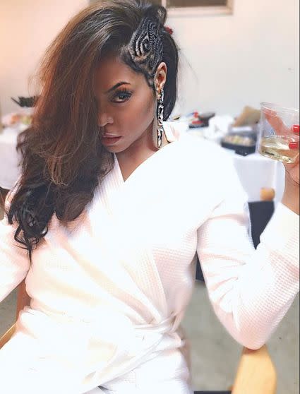 Henson looked white hot (even in a robe) as she geared up to host "Taraji and Terrence's White Hot Holidays" on Fox. Celebrity stylist and Mizani artist Cesar Ramirez came up with this "Urban Veronica Lake" look by combining voluminous waves with intricate side braids. <i>He prepped Henson's damp hair with <a href="http://www.ulta.com/ulta/browse/productDetail.jsp?productId=xlsImpprod4860059" target="_blank">Mizani Therma Strength Heat Protecting Serum</a> to minimize breakage while blow-drying and curling.&nbsp;</i>