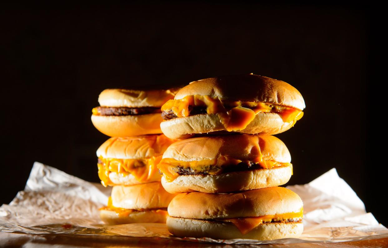 File photo dated 09/07/14 of a pile of cheeseburgers. Ultra-processed foods (UPFs), alcohol, tobacco and fossil fuels are killing 2.7 million people every year across Europe, according to the World Health Organisation (WHO). Experts said 