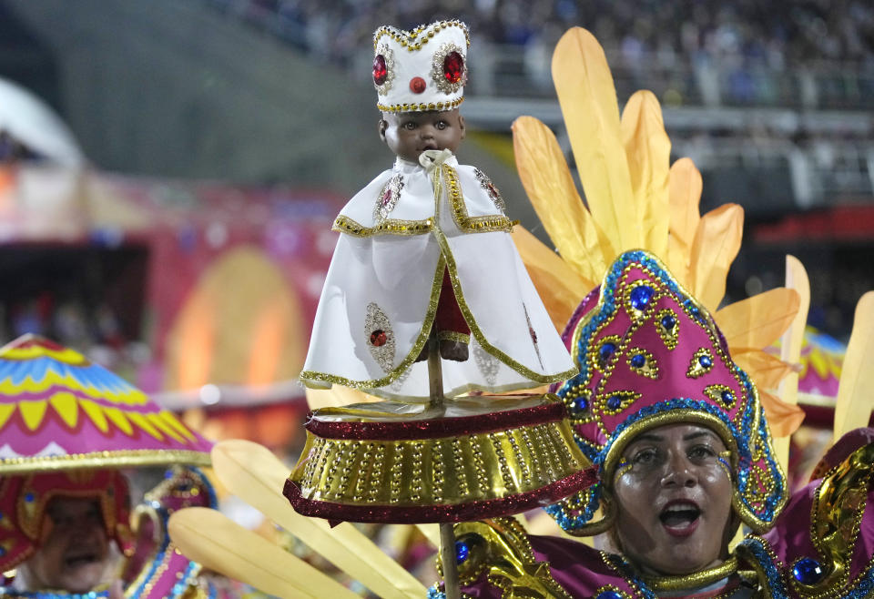 Performer from the Vila Isabel samba school parades during Carnival celebrations at the Sambadrome in Rio de Janeiro, Brazil, Tuesday, Feb. 21, 2023. (AP Photo/Silvia Izquierdo)