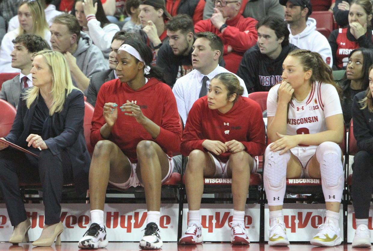 Wisconsin's Serah Williams (second from left) and Sania Copeland sit on the bench during the team's loss to Saint Louis on Monday night at the Kohl Center.