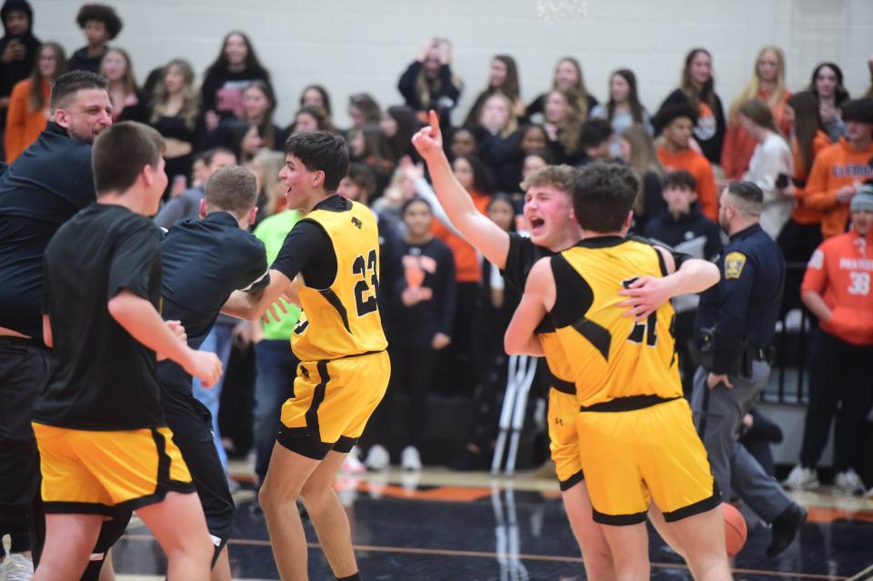 Red Lion players celebrate after they beat Central York, 66-65, in the District 3 Class 6A quarterfinals Friday, Feb. 23, 2024.