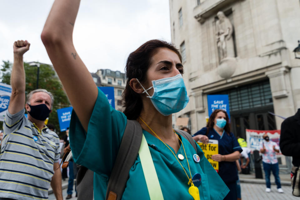 A nurse holds a placard as they demonstrate in front of BBC Broadcasting House in London, Britain, 12 September 2020. In July  the government announced a pay rise for public sector workers. But many nurses, health care assistants, porters, and cleaners who worked so hard, despite the risks, have been overlooked in the public sector pay rise. (Photo by Maciek Musialek/NurPhoto via Getty Images)