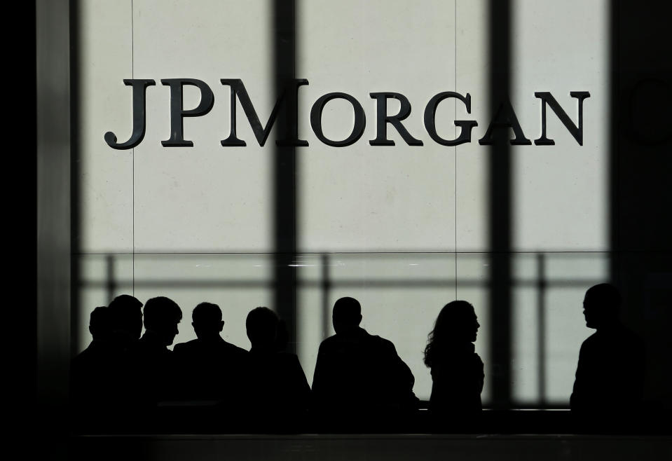 FILE - In this Monday, Oct. 21, 2013, file photo, the JPMorgan Chase logo is displayed at their New York headquarters.  JPMorgan Chase said on Tuesday, July 13, 2021, that second-quarter earnings doubled from a year ago — a reflection of the improving global economy and a decline in bad loans on its balance sheet.  (AP Photo/Seth Wing, File)