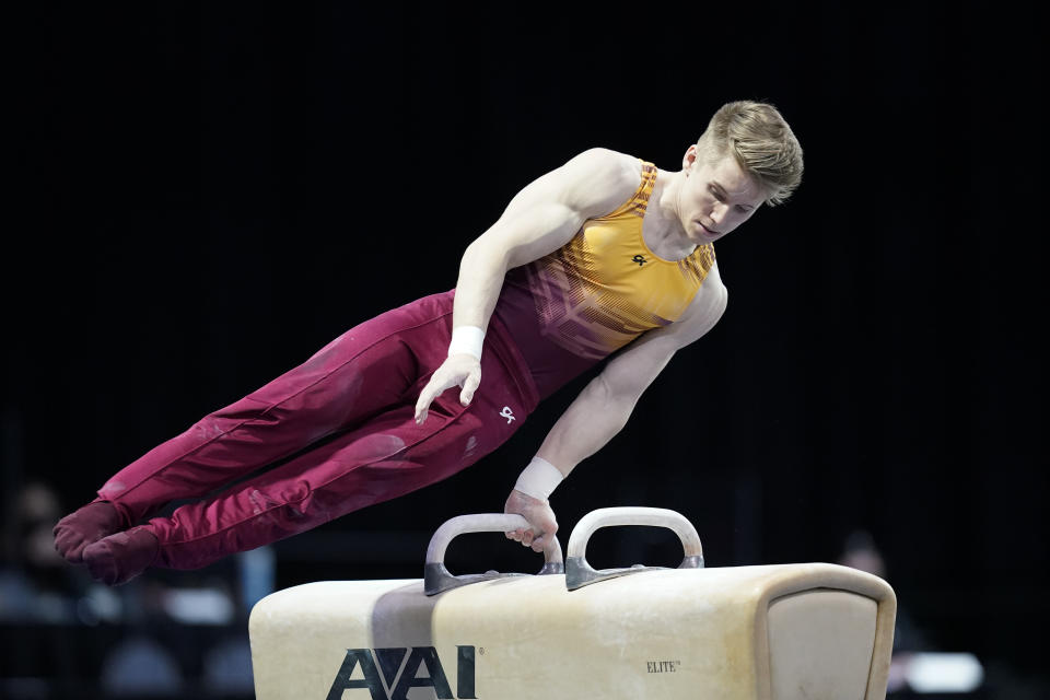 Shane Wiskus, representing the University of Minnesota, competes during the Winter Cup gymnastics event Friday, Feb. 26, 2021, in Indianapolis. The University of Minnesota and the University of Iowa will stop offering men's gymnastics as a scholarship sport at the end of the month. Wiskus wants to be part of the U.S. Olympic gymnastics team. It's one of the reasons he left Minnesota last fall for the U.S. Olympic and Paralympic Training Center in Colorado Springs, Colorado. (AP Photo/Darron Cummings)