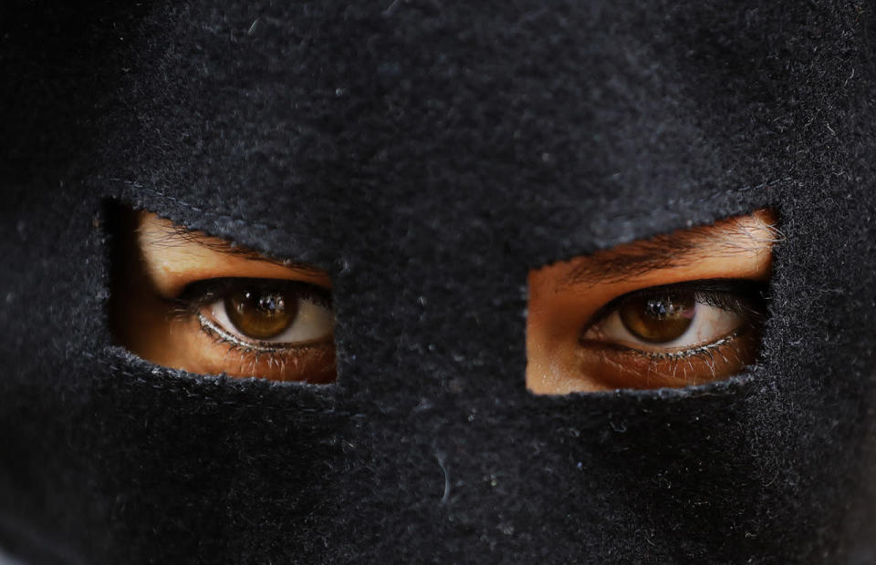 <p>Activist protests wears a mask outside the French embassy</p><p>An activist protests wears a mask outside the French embassy during, the “wear what you want beach party” in London, Aug. 25, 2016. The protest is against the French authorities clampdown on Muslim women wearing burkinis on the beach. (Photo: Frank Augstein/AP)</p>