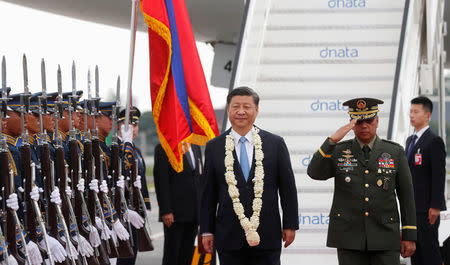 China's President Xi Jinping walks past honour guards upon his arrival at Ninoy Aquino International airport during a state visit in Manila, Philippines, November 20, 2018. At right is Philippine armed forces chief General Carlito Galvez.REUTERS/Erik De Castro