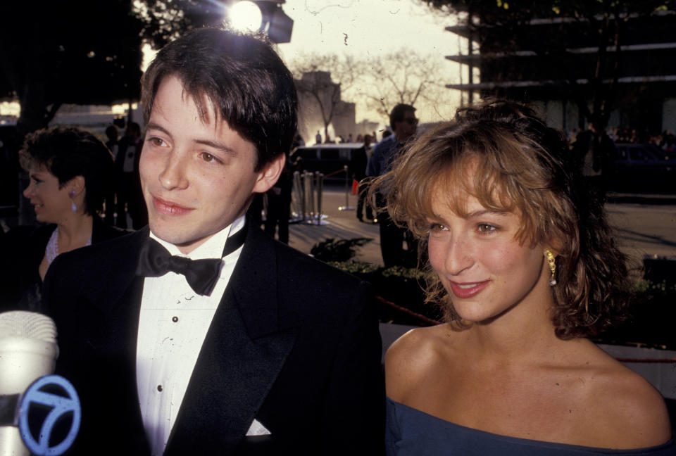 Matthew Broderick and Jennifer Grey smiling on a red carpet