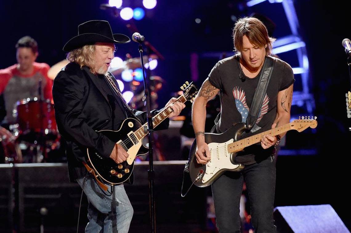 ARLINGTON, TX - APRIL 18: Musicians John Anderson (L) and Keith Urban perform onstage during ACM Presents: Superstar Duets at Globe Life Park on April 18, 2015 in Arlington, Texas.