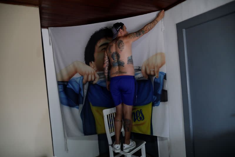 The Wider Image: Argentines celebrate 'eternal love' for Maradona with tattoos