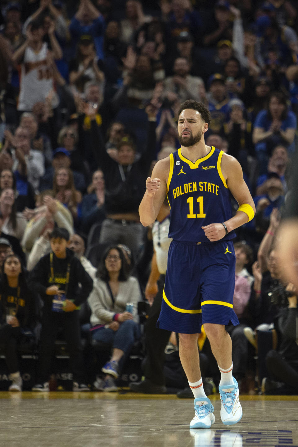 Golden State Warriors guard Klay Thompson (11) reacts after making a 3-point basket against the Minnesota Timberwolves during the first quarter of an NBA basketball game, Sunday, March 26, 2023, in San Francisco. (AP Photo/D. Ross Cameron)