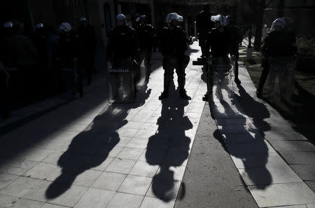 Riot police officers stand guard during a protest against Serbian President Aleksandar Vucic and his government, outside the presidential building in Belgrade, Serbia, March 17, 2019. REUTERS/Marko Djurica