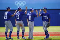 Israel's Assaf Lowengart, from right, celebrates with Ty Kelly, Danny Valencia and Benjamin Wanger after Israel won a baseball game against Mexico at Yokohama Baseball Stadium during the 2020 Summer Olympics, Sunday, Aug. 1, 2021, in Yokohama, Japan. (AP Photo/Matt Slocum)