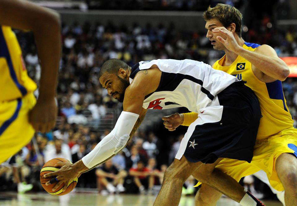 WASHINGTON, DC - JULY 16: Tyson Chandler #4 of the US Men's Senior National Team holds of Tiago Splitter #15 of Brazil from stealing the ball during the first quarter during a pre-Olympic exhibition basketball game at the Verizon Center on July 16, 2012 in Washington, DC. (Photo by Patrick Smith/Getty Images)